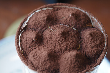 Delicious chocolate dessert layered with cocoa powder in close-up
