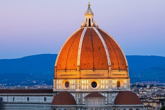 A sunset view of Florence&acirc;&euro;&trade;s Cathedral dome (Duomo di Firenze), glowing in warm orange light