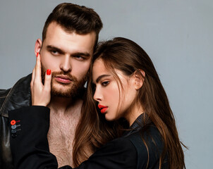 Man brutal well groomed macho and attractive feminine girl long hair cuddling. Sexy couple in love....