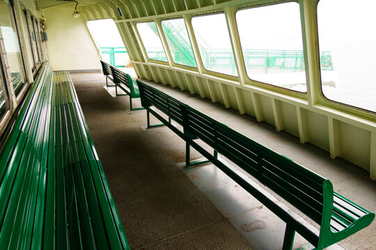 Row of benches and windows, ferry crossing Puget Sound from Edmonds to Kingston, Washington.