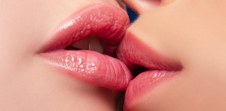 Lesbian couple kiss. Two lesbians kissing. Sensual lips. Sexy lips of lesbians couple kiss. Passion and sexy sensual touch. Lesbian lips. Lesbian concept.