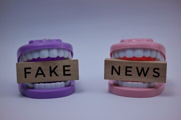 Conceptual Image of Fake News with Toy Teeth Representations