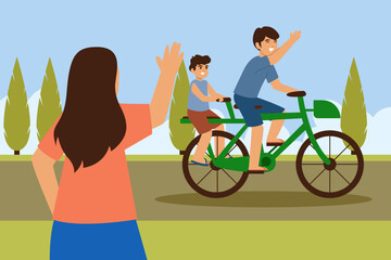 Fototapeta premium A woman waves goodbye to a father and son riding a tandem bicycle on a sunny day in the park.