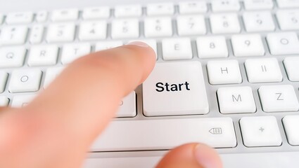 finger pressing start button keyboard beginning new project action initiate go forward technology

