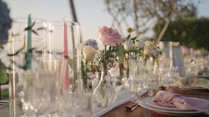 close up wedding set up bouquet flower candle tablecloth catering dinner party reception.