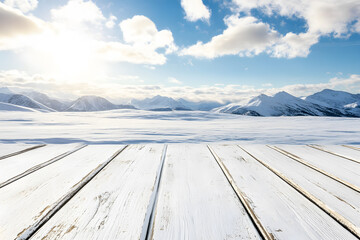 Empty white wooden floor or table podium. Landscape mountain surrounded by snow is background. Blue sky with white clouds, bright sunlight. Abstract Texture. Advertising display.