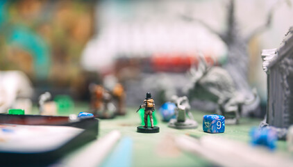 Role playing tabletop game miniatures adventure in dungeon story TTRPG on gamer crafting table