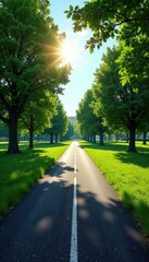 Obraz premium Sun-drenched asphalt ribbon cuts through verdant park, clear sky above , route, unobstructed