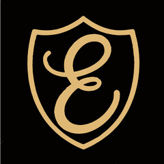 Whimsical Gold Emblem with Letter E
