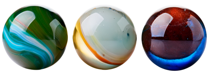 shiny glass marble ball toys in three color and pattern variations isolated on white background