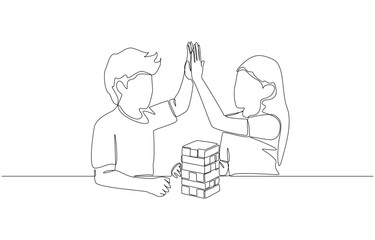Continuous one line drawing of boy and girl high five each other after completing puzzle blocks, teamwork and play concept, single line art