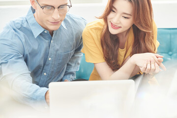 Business Meeting Collaboration with Man and Woman on Sofa