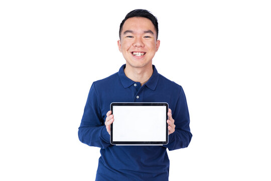 A young man in a blue long-sleeve polo shirt holds a tablet in front of his chest with a bright blank screen. White background. Ideal for mockups, app presentations, or digital content placement. - Powered by Adobe
