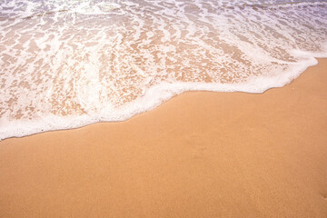 Nature of the beach and sea Summer with sunshine, sandy beaches, clear blue waters sparkling against the blue sky. On an island with good ecology and environment Background for summer vacation