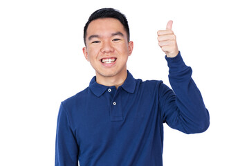 A young man in a blue long-sleeve polo shirt gives a thumbs up while smiling confidently. White...