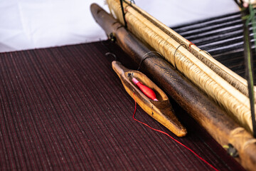 Traditional loom machine vintage style is tool for weave of making silk from cocoon use by homemade...