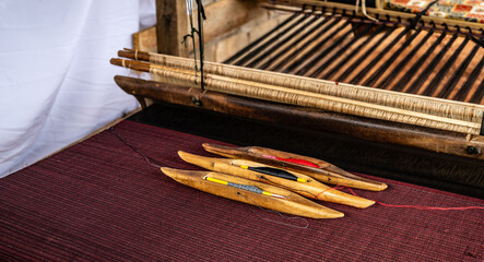 Traditional loom machine vintage style is tool for weave of making silk from cocoon use by homemade...