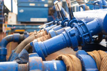 Close-up at high-pressure iron line of fluid pumping machine in oil operation activity. Industrial...