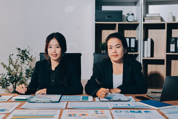 Accounting company provide finance and taxation planning for profitable cash flow, Auditor and accountant team working in office, analyze financial data and accounting record with calculator.Insight