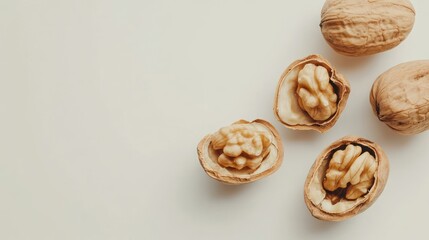 Fototapeta premium A handful of Walnuts Shelled and Unshelled on a White Background