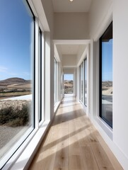 Fototapeta premium Long corridor bathed in sunshine, showcasing large windows and minimalist decor; hardwood floors gleam - peaceful home neat floors