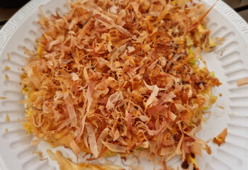 This is okonomiyaki filled with bonito flakes.