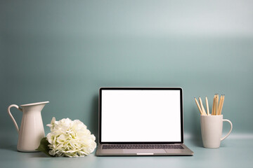 laptop with flowers on the table, minimal lifestyle