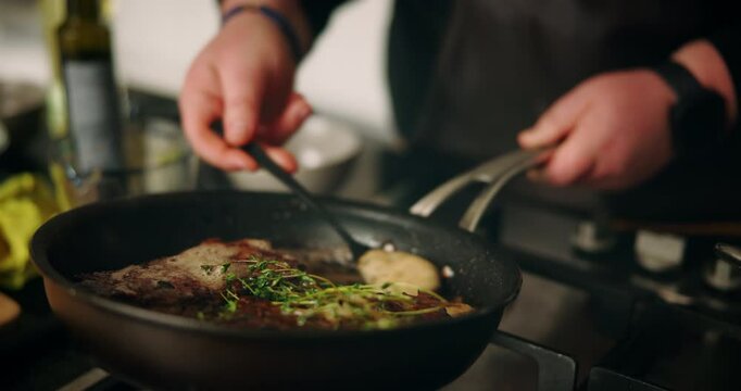 Recipe, hands and meat in frying pan in kitchen for cooking dinner, meal preparation and sear beef cuisine. Chef, person and steak with herbs for healthy ingredients, nutrition and lunch food in home