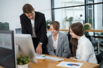 Team collaboration on business analytics in a modern office space during a productive meeting