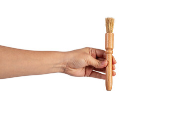 Hand using a little paintbrush isolated on a transparent background