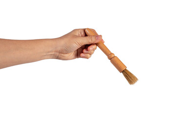 Hand using a little paintbrush isolated on a transparent background