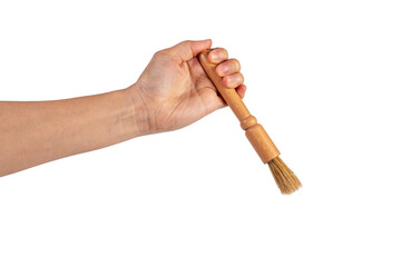 Hand using a little paintbrush isolated on a transparent background