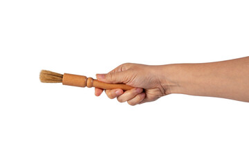 Hand using a little paintbrush isolated on a transparent background