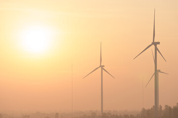 Fototapeta premium Wind turbines generate electricity at sunset in Europe and Asia..