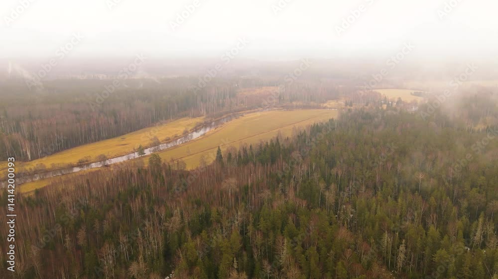 Poster aerial view of a winding river through autumn fields and forests under an overcast sky, with visible
