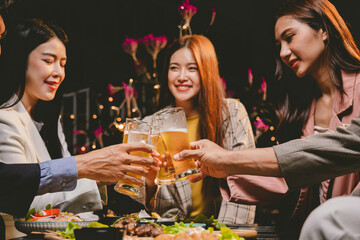 Cheerful multiracial friends dance, drink, and laugh together at a lively nightclub, celebrating friendship, joy, and carefree moments all night.