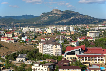 Naklejka premium View of modern residential buildings against the backdrop of mountains. Sudak resort town, Crimea