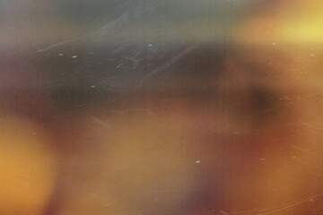 grainy colorful warm orange light leaks on black background with dust texture. abstract damaged scratched retro film analog effect for using over photos as overlay or screen filter
