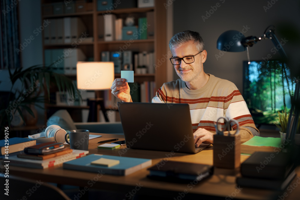 Canvas Prints smiling man doing online shopping using a credit card