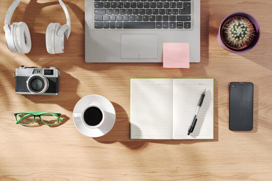 Home office desk with laptop and personal items