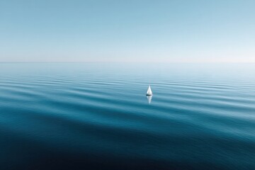 Calm ocean surface reflects serenity, small sailboat gliding thr