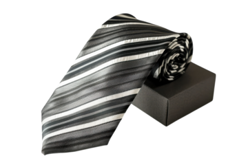 Elegant black and white striped tie arranged skillfully with a minimalist box setting isolated on transparent background