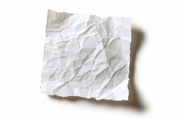Obraz premium A crumpled piece of white paper lying on a clean surface illuminated by soft light isolated on transparent background