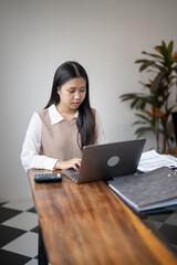 Beautiful confident asian business woman working with laptop Hands typing  keyboard. Professional investor working new start up project. business planning in office. Technology business.