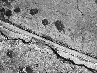Crack wall texture background broken earthquake effect, whtie grey building cement damage pattern...