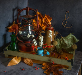 Generated imageStill life with a kerosene lamp, a ceramic teapot, and dried plants.