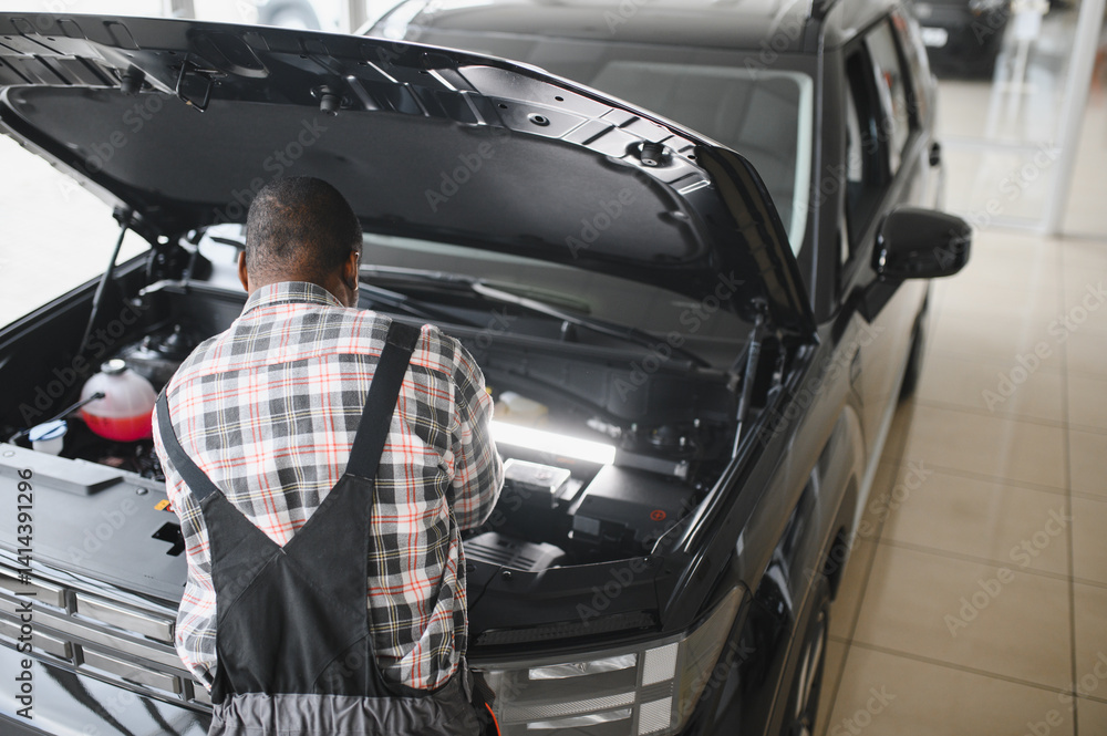 Poster engineer expertly examines car motor using advanced mechanical tools, ensuring optimal automotive pe
