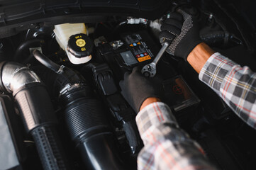 Car mechanic in auto repair service