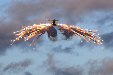 Royal Navy Merlin Helicopter Fires Flares from HMS Prince of Wales During NATO Exercise