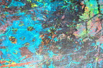 Thick abstract paint surface with heavy texture looking a bit like graffiti hand drawn real dark background